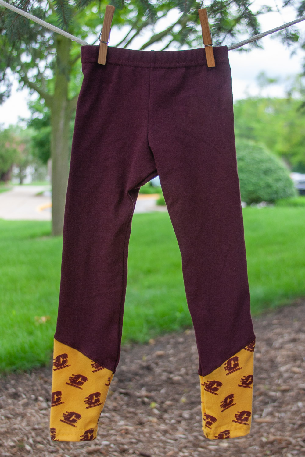 Maroon Girls Leggings with Flying C Gold Bottom The CMU Bookstore